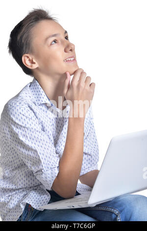 Studio Portrait von Teenager mit Laptop Stockfoto