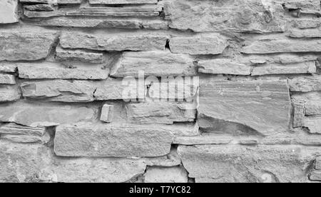 Naturstein grauer Hintergrund oder Textur. Verschiedene Steine und Beton. Stockfoto