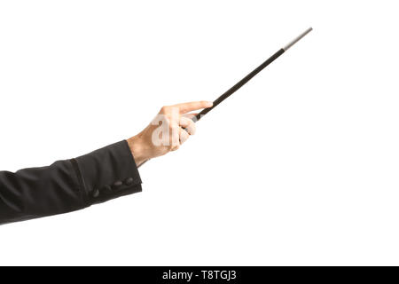 Hand der Illusionist mit Zauberstab auf weißem Hintergrund Stockfoto