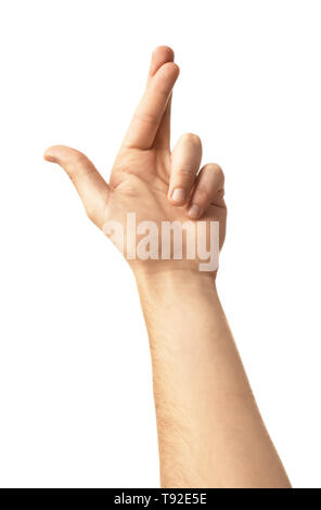 Männliche hand mit gekreuzten Fingern auf weißem Hintergrund Stockfoto