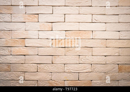 Brick Wall Panoramablick auf die Textur in Heim- und Bürobereich, Dürfen die Inneren. Abstrakte alte Hellbeige von Steinmauern. Vintage Braun Mauer Hintergrund Stockfoto