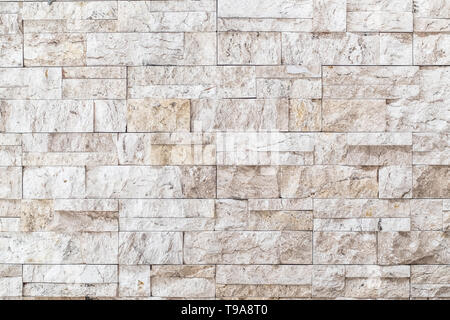Schwarze und weiße Mauer Kunst aus Beton oder Stein Textur Hintergrund in Weiß Stockfoto