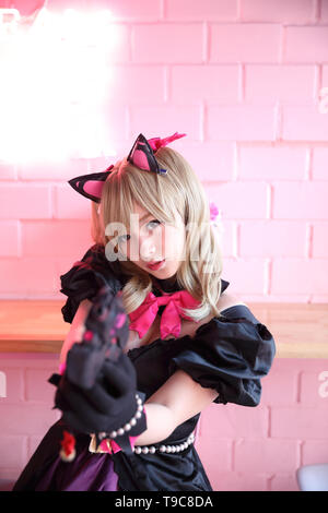 Japan Anime Cosplay cosplay, Portrait von Mädchen in rosa Zimmer Hintergrund Stockfoto