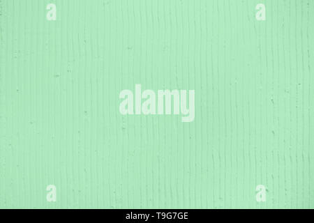 Detailansicht der Wand mit einem decorativetrendy Farbige mint Gips vertikale Linien und Streifen. Strukturierte Betonwand mit als Textur oder Hintergrund. R Stockfoto