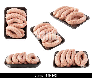 Satz von rohwürsten auf schwarze Schaumstoffeinlage Schuß aus verschiedenen Blickwinkeln. Isoliert. Stockfoto