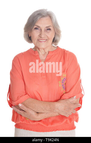 Portrait von lächelnden älteren Frau in orange Bluse Stockfoto