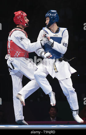 Manchester. 19 Mai, 2019. Chinas Zhao Shuai (R) konkurriert gegen Irans Soroush Ahmadi während der Männer -63 kg Finale bei den World Taekwondo Championships 2019 in Manchester, Großbritannien am 19. Mai 2019. Zhao gewonnen 27-7. Credit: Jon Super/Xinhua/Alamy leben Nachrichten Stockfoto