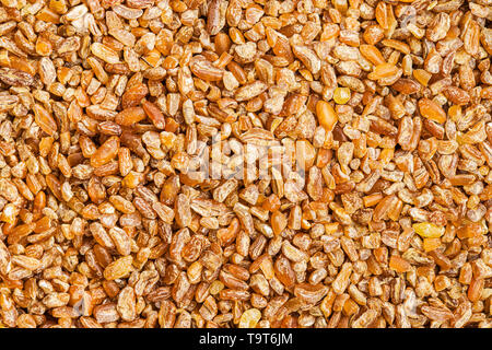 Trockene Bulgur weizen Körner. Ansicht von oben Textur. Stockfoto