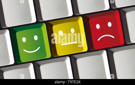 Tasten mit Emoticons auf einer PC-Tastatur - Bewertung, Feedback Konzept - Smily auf Tasten Stockfoto