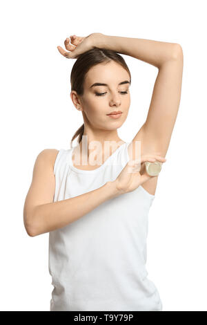 Schöne junge Frau mit Deodorant auf weißem Hintergrund Stockfoto