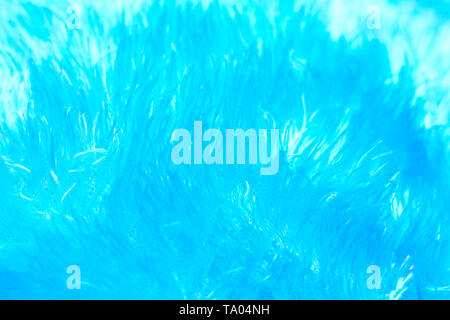 Textur von flauschigen Stoff in blau Neon Neon Pastellfarben. Makro Stockfoto