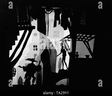 Das Foto zeigt eine Szene aus dem Silhouette Film "Die Abenteuer des Prinzen Achmed" von Charlotte Reiniger. Die silhouette Film, auch als Silhouette Animation bekannt, ist eine Technik der Animationsfilm in die Silhouetten zusammen auf einem beleuchteten Glasplatte vor einem weißen oder schwarzen Hintergrund gestellt werden, um einen Film zu bilden. Das Ergebnis ist die Silhouette Film, inspiriert von shadow Theater und der bildnerischen Techniken von Silhouette schneiden. Stockfoto