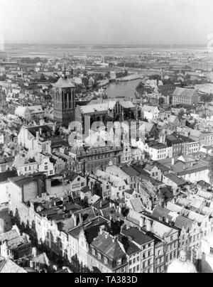 Blick auf die Kirche St. Johannes in Danzig. Die Kirche ist Johannes dem Täufer und Johannes dem Evangelisten geweiht. Die Kirche St. Johannes auf dem Gelände der ehemaligen St. John's Kapelle im Jahre 1377 erbaut. Stockfoto