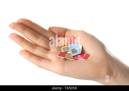 Weibliche Hand, die SIM-Karten auf weißem Hintergrund Stockfoto