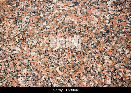 Maple Leaf red Granit Hintergrund. Rot und Schwarz gefärbten Granit Textur beschmutzt. Stockfoto