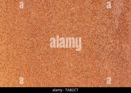 Close-up Makro Ansicht von melierter Altes rostiges Metall oberfläche Gelb und Orange. Detaillierte Muster Textur oder Hintergrund in natürlicher Umgebung. W Stockfoto