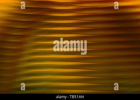 Abstrakte verschwommenen Hintergrund. Gold Linien und Kurven. Gestreifte Muster. Stockfoto