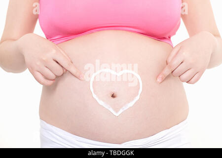 Schwangere Frauen Pflege für Baby Wachstum Stockfoto