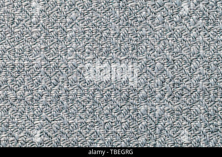 Grau vintage Gewebe mit eingewebten Textur closeup. Textile Makro Hintergrund. Dunkles Silber kammgarn Kulisse. Stockfoto
