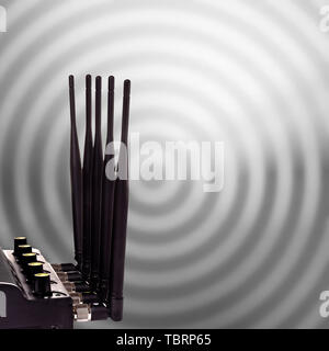 Router schwarz mit Antenne auf einem funkwellen Hintergrund geschnitzt Stockfoto