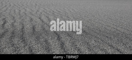 Schwarzen Sand Wellen als Hintergrund Stockfoto