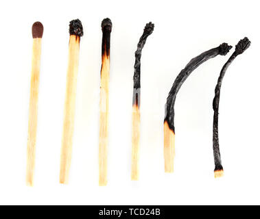 Gebrannte Spiele und ein ganzes Match isoliert auf weißem Stockfoto