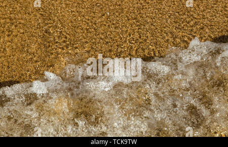 Sand und Meer Nahaufnahme, Ansicht von oben Stockfoto