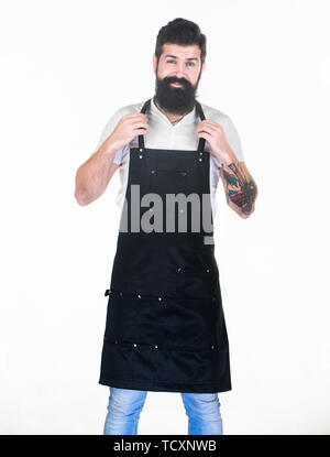 Er ist der beste Friseur. Der bärtige Mann, der Friseur Schürze. Hipster in Arbeit Schürze mit vielen Taschen. Friseur der Friseur. Barbershop oder Friseur. Stockfoto