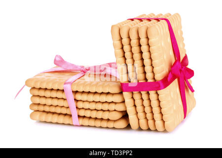 Süße cookies gebunden mit rosafarbenen Bändern isoliert auf weißem Stockfoto