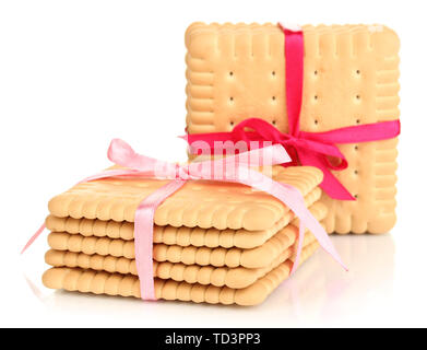 Süße cookies gebunden mit rosafarbenen Bändern isoliert auf weißem Stockfoto