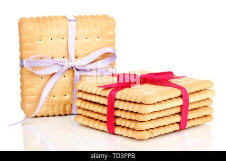 Süße cookies gebunden mit bunten Bändern isoliert auf weißem Stockfoto