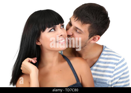 Schöne liebevolle Paar küssen isoliert auf weißem Stockfoto