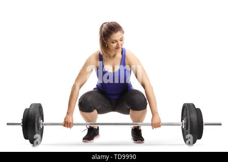 Junge Frau Vorbereiten der Gewichte auf weißem Hintergrund heben Stockfoto