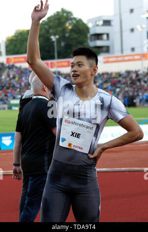 Oslo, Norwegen. 13. Juni, 2019. Xie Zhenye () reagiert nach 100 m der Männer an der IAAF Diamond League in Oslo, Norwegen, am 13. Juni 2019. Credit: Liang Youchang/Xinhua/Alamy leben Nachrichten Stockfoto