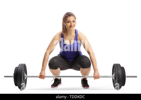 Fröhliche junge Frau, Gewichte zu heben und lächeln in die Kamera auf weißem Hintergrund Stockfoto