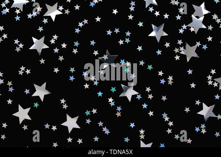 Golden Star Streusel auf Rosa. Festliche Hintergrund. Feier Konzept. Ansicht von oben, flach. Horizontale Stockfoto