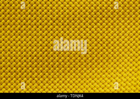 Gelbe Nylongewebe Textur Hintergrund. Dicker Stoff für Rucksäcke und Sportgeräte Stockfoto