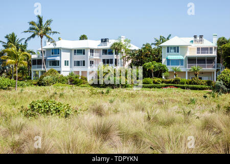 Sanibel Island Florida, East Gulf Drive, Häuser am Strand, große Einfamilienhäuser, mehrstöckige, Düne, Gräser, Besucher reisen auf Reisen Stockfoto