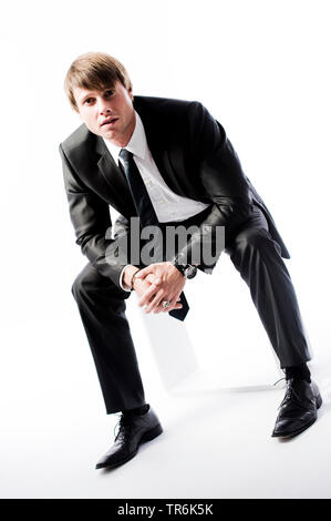 Junger Mann in Business Look Stockfoto