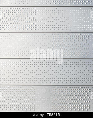 Braille - wie Textur auf Metallplatten Stockfoto