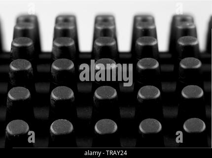 Makro Bild der Mandeln eines schwarzen Gummi Münze mat Stockfoto