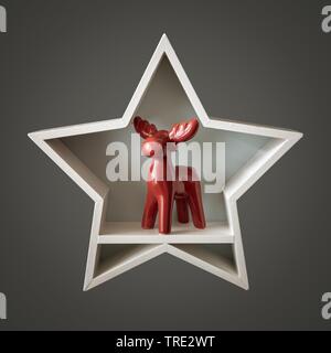Weihnachtsdekoration weiß Stern mit Rotwild innen mit Rentier Rudolph Stockfoto