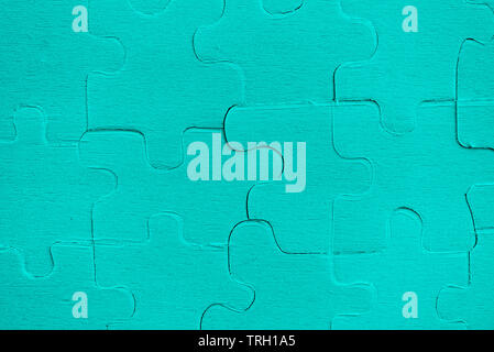 Puzzles Puzzles/Blau der Puzzleteile auf Textur Hintergrund Stockfoto