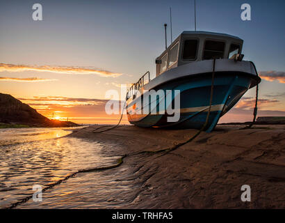 Sonnenuntergang am Strand in Bude an der Küste von North Cornwall, England, Großbritannien Stockfoto