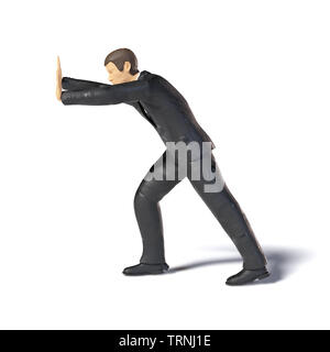 Spielzeug miniatur Geschäftsmann drücken Abbildung heben, figurine Konzept mit Schatten auf weißem Hintergrund Stockfoto