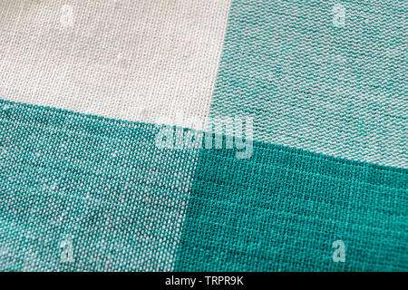 Lendenschurz Stoff grün weiß Tisch Textur Hintergrund Stockfoto