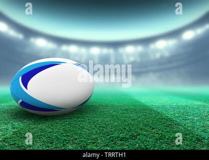 Eine reguar Weiß rugby ball mit blauen Design Elemente auf ein Stadion rasen in der Nacht ruht unter beleuchtet Fluter - 3D-Rendering Stockfoto