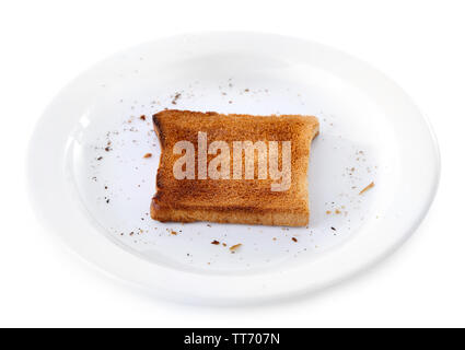 Burnt Toast Brot auf dem Teller, auf weißem Hintergrund Stockfoto