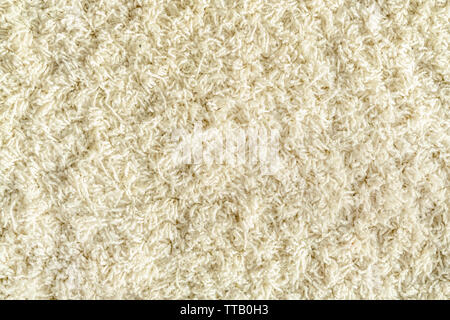 Textur von einem weissen Teppich mit langem Flor Stockfoto