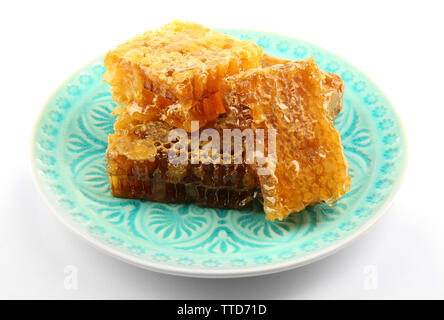 Waben auf Platte auf Weiß isoliert Stockfoto